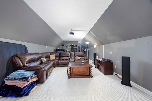 cinema with lofted ceiling, carpet, and baseboards