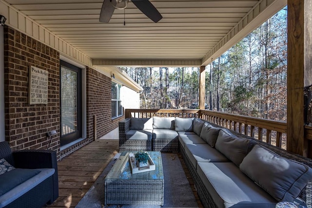 wooden deck featuring ceiling fan and an outdoor hangout area