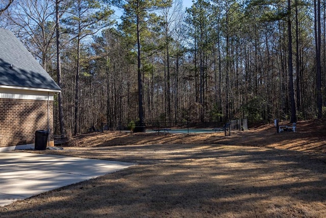 view of yard featuring a wooded view