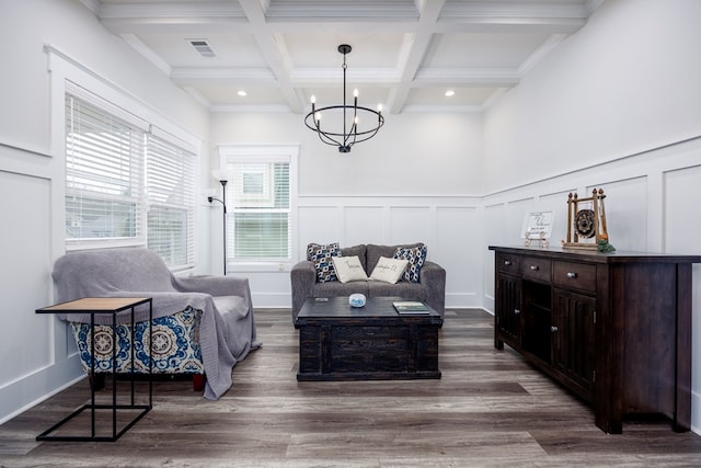 living room featuring beam ceiling, a chandelier, dark wood-type flooring, and coffered ceiling