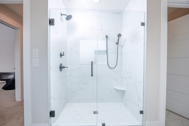 bathroom featuring an enclosed shower