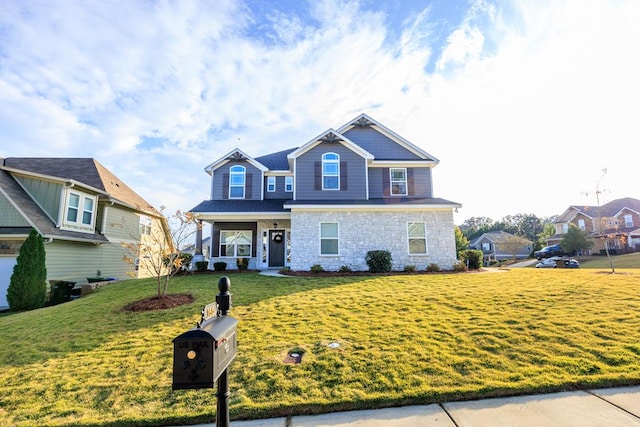 view of front of home featuring covered porch and a front lawn