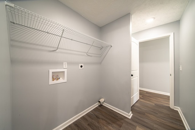 laundry area with hookup for a washing machine, dark hardwood / wood-style flooring, a textured ceiling, and hookup for an electric dryer