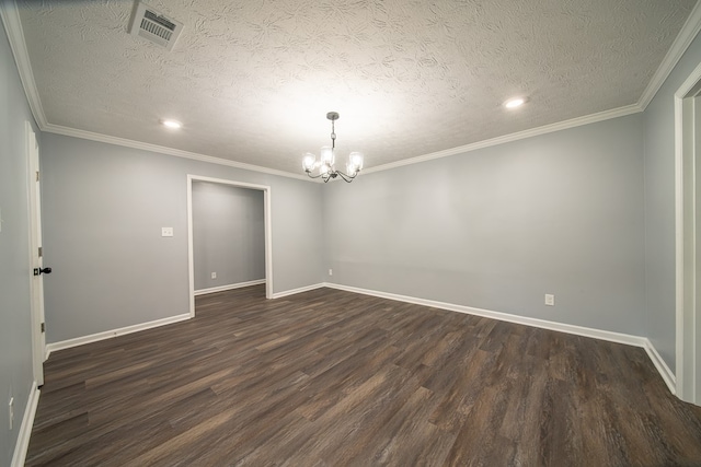 empty room featuring dark hardwood / wood-style flooring, a textured ceiling, and an inviting chandelier