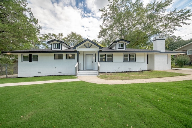 ranch-style house with a front lawn