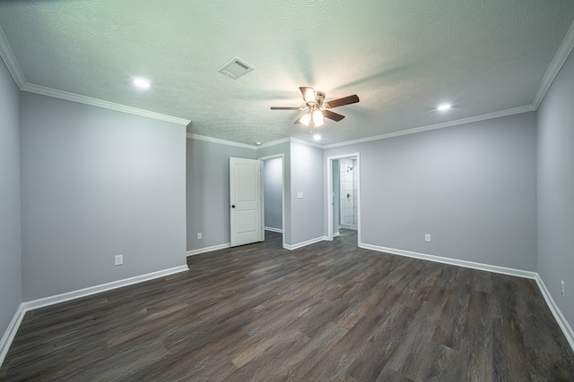 spare room with a textured ceiling, dark hardwood / wood-style flooring, and crown molding