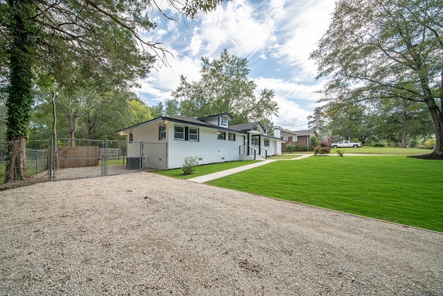 rear view of house with a yard