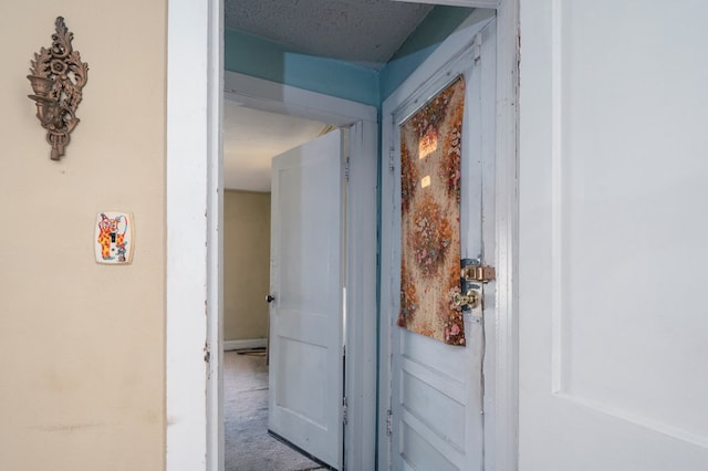 hallway featuring carpet flooring