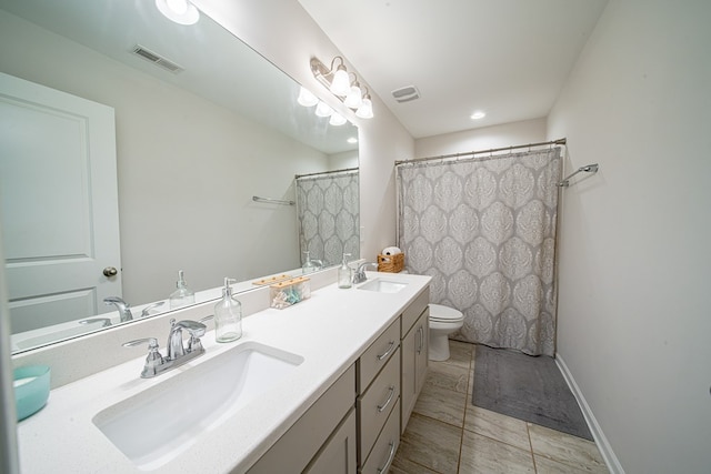 full bathroom featuring visible vents, a sink, toilet, and double vanity