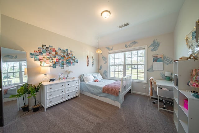 bedroom with baseboards, dark carpet, and visible vents
