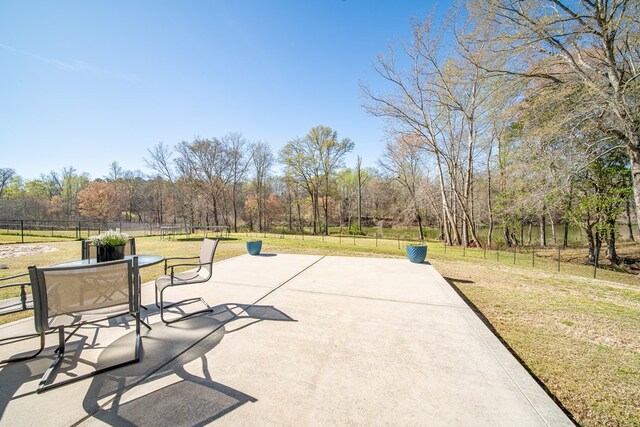 view of patio featuring fence