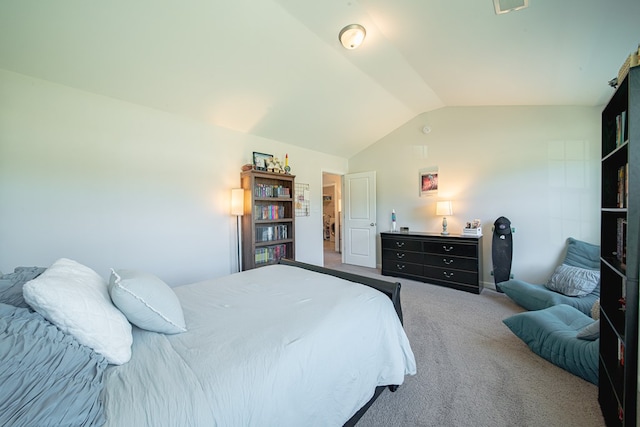 carpeted bedroom featuring lofted ceiling and visible vents