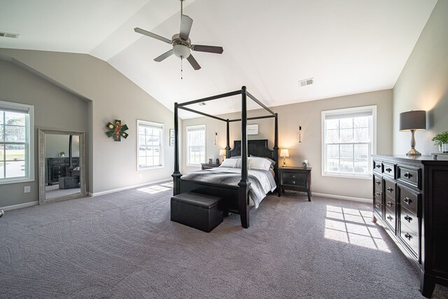 carpeted bedroom featuring baseboards, lofted ceiling, and visible vents