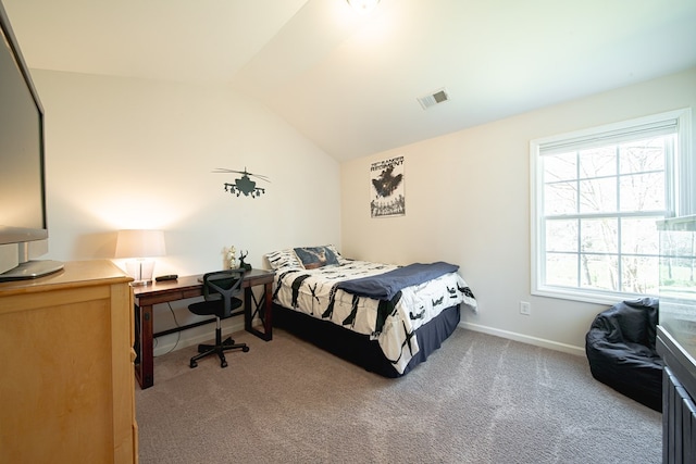 carpeted bedroom with baseboards, vaulted ceiling, and visible vents