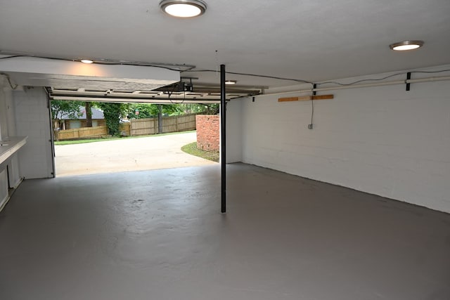 3919 Gray Fox Dr, Columbus, GA 31909 - garage with concrete block wall and a garage door opener