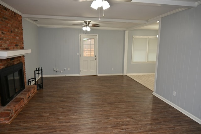 3919 Gray Fox Dr, Columbus, GA 31909 - unfurnished living room with wood finished floors, ceiling fan, crown molding, a brick fireplace, and beamed ceiling