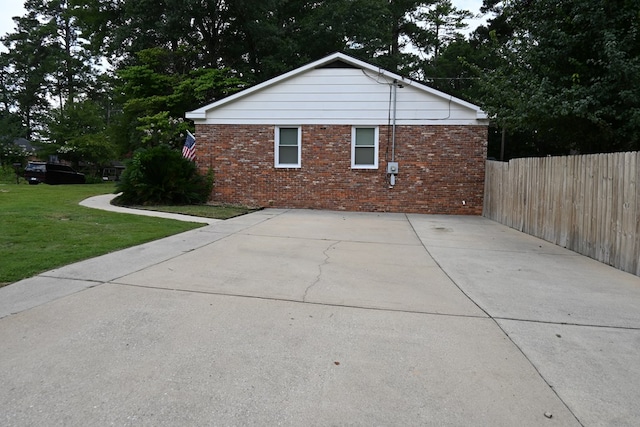 3919 Gray Fox Dr, Columbus, GA 31909 - view of side of property with brick siding and concrete driveway