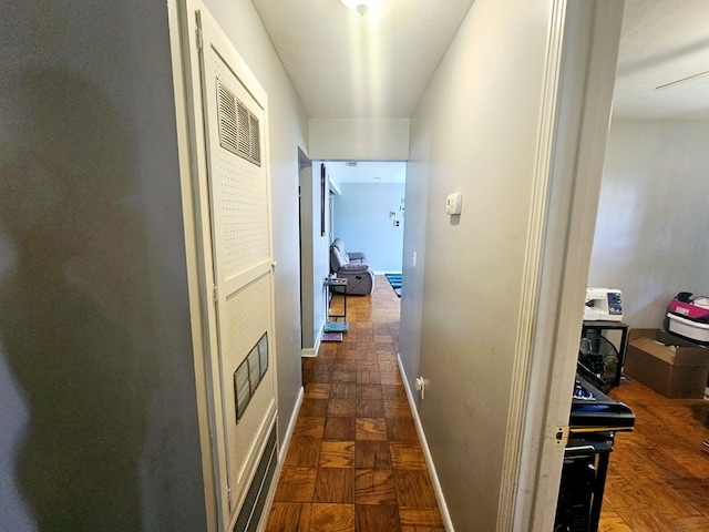 hall featuring baseboards