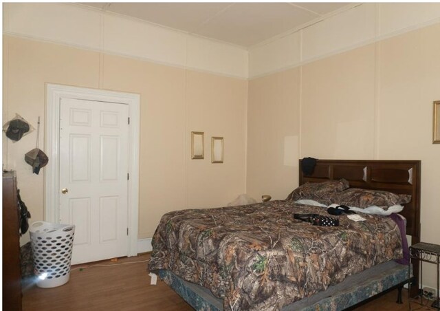 bedroom featuring dark hardwood / wood-style floors