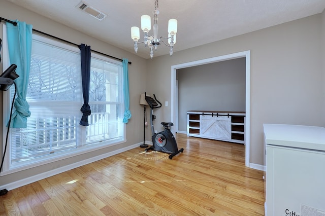15 Whitetail Rd, Seale, AL 36875 - exercise room with a chandelier and wood finished floors