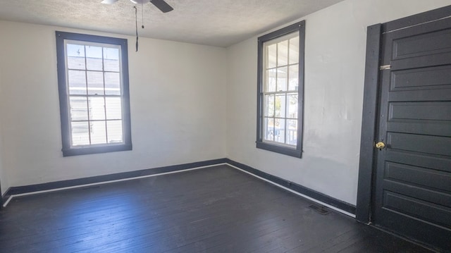 1312 Juniper St, Lagrange, GA 30240 - empty room featuring a textured ceiling, dark wood-style flooring, a ceiling fan, healthy amount of natural light, and baseboards