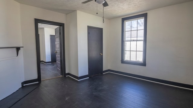 1312 Juniper St, Lagrange, GA 30240 - spare room featuring dark wood finished floors, a textured ceiling, ceiling fan, and baseboards
