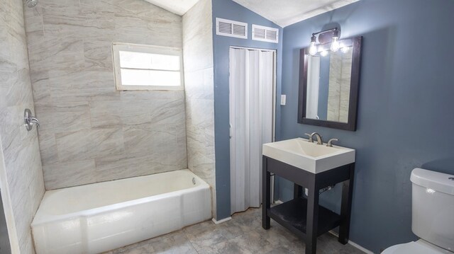 1312 Juniper St, Lagrange, GA 30240 - bathroom featuring toilet, lofted ceiling,  shower combination, and vanity