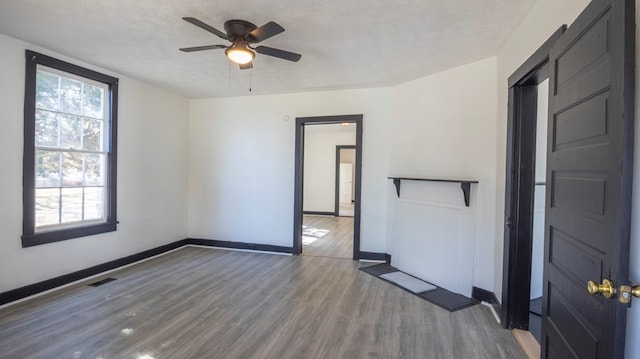 1312 Juniper St, Lagrange, GA 30240 - unfurnished room with baseboards, wood finished floors, ceiling fan, and a textured ceiling