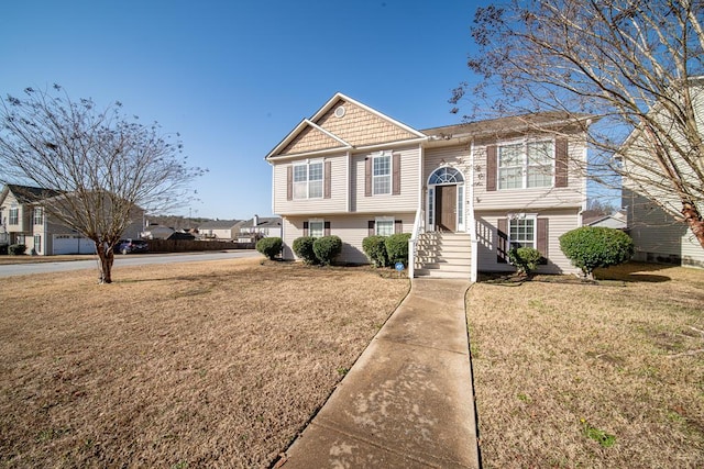 split foyer home featuring a front yard