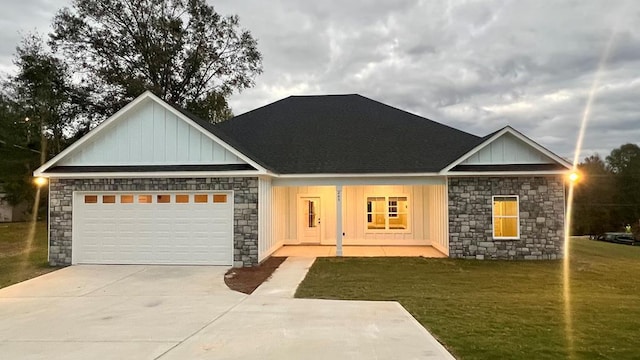 view of front of property with a garage and a front yard