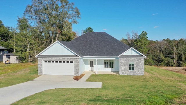 view of front of house with a front lawn and a garage