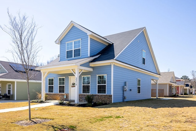 view of front of property featuring a front yard and stone siding