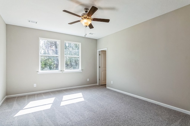 carpeted empty room featuring ceiling fan