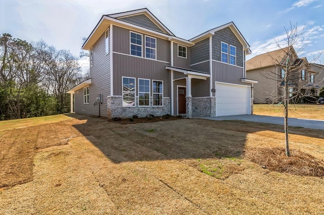 view of front of home with a garage and a front lawn