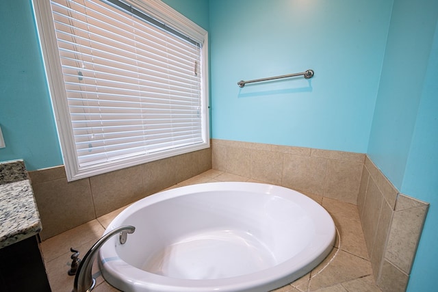 full bathroom with a garden tub and vanity