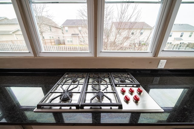 room details with dark countertops and gas stovetop