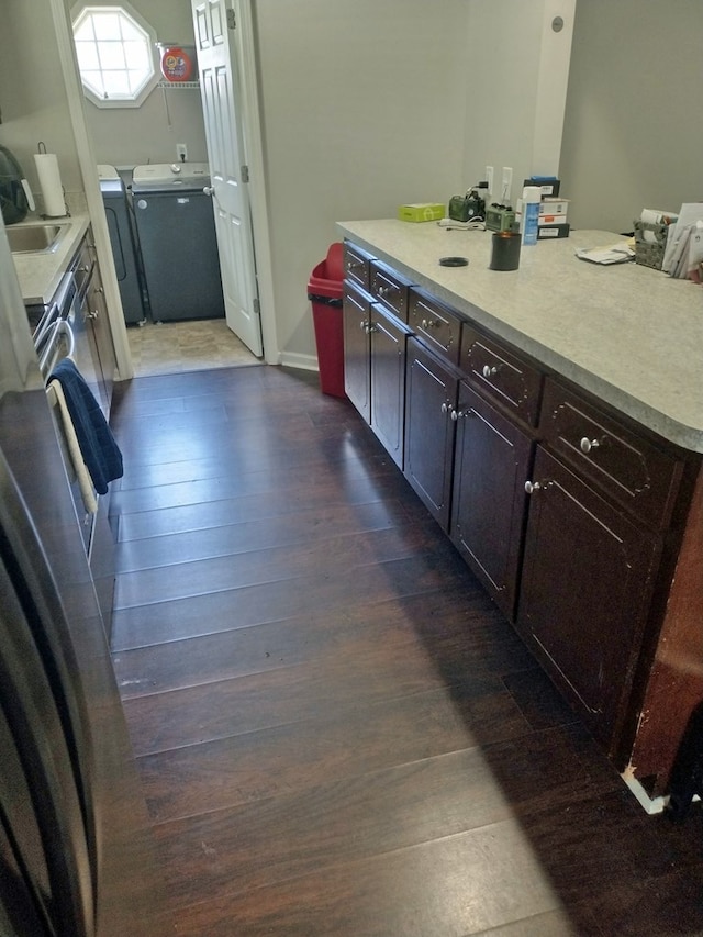 6099 Mary Allison Dr, Columbus, GA 31907 - kitchen featuring washer and clothes dryer, dark wood finished floors, light countertops, and a center island