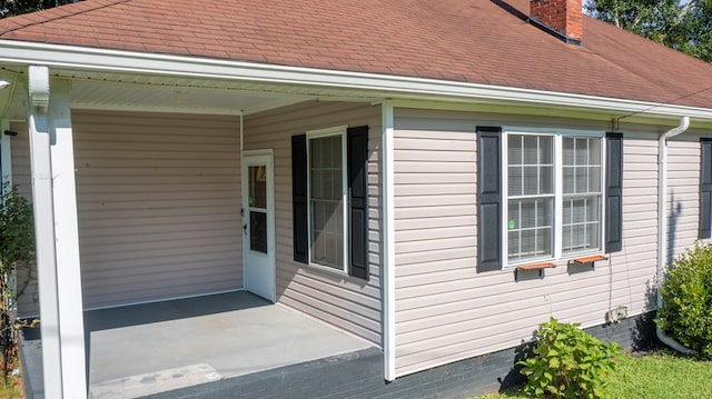 400 Lawrence St, Hogansville, GA 30230 - view of side of home with a chimney, roof with shingles, crawl space, and covered porch