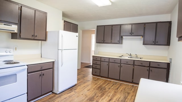 400 Lawrence St, Hogansville, GA 30230 - kitchen with white appliances, ventilation hood, light wood-type flooring, and light countertops