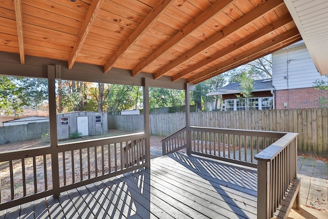 deck with a storage shed