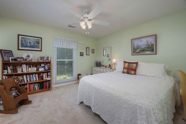 bedroom featuring visible vents, carpet, and ceiling fan