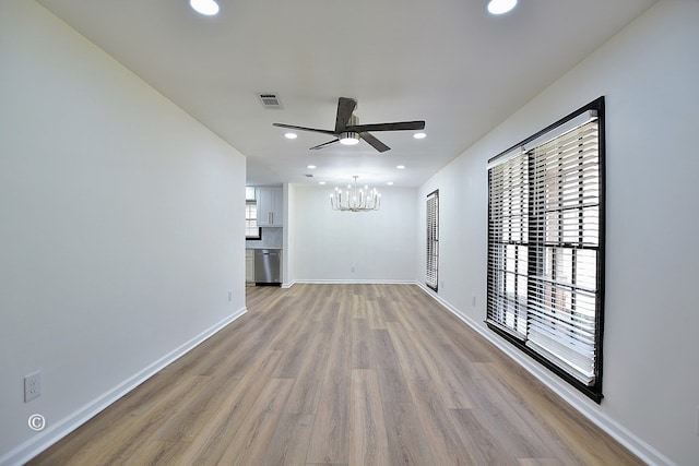 385 Hudson Mill Cir, Hamilton, GA 31811 - unfurnished living room featuring a chandelier, wood finished floors, recessed lighting, ceiling fan, and baseboards