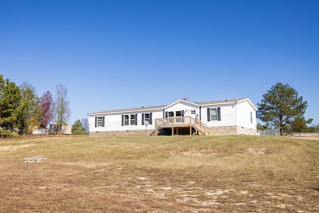 back of house with a yard and a deck