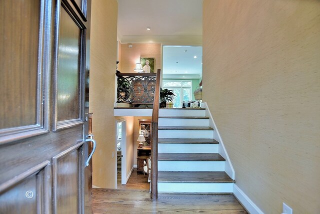 6528 Standing Boy Dr, Columbus, GA 31904 - stairs featuring baseboards, wood finished floors, and crown molding
