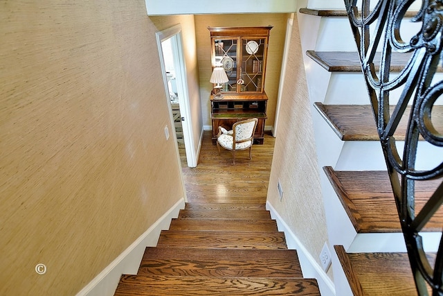 6528 Standing Boy Dr, Columbus, GA 31904 - stairway with wood finished floors and a textured wall