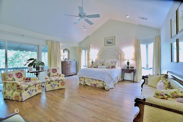 6528 Standing Boy Dr, Columbus, GA 31904 - bedroom featuring visible vents, multiple windows, wood finished floors, and high vaulted ceiling