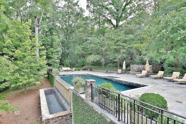 6528 Standing Boy Dr, Columbus, GA 31904 - pool with a patio and a view of trees