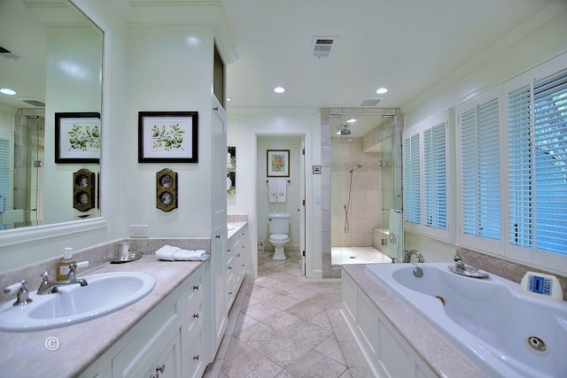 6528 Standing Boy Dr, Columbus, GA 31904 - bathroom featuring a shower stall, toilet, vanity, visible vents, and a garden tub