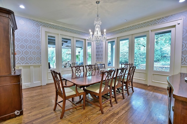 6528 Standing Boy Dr, Columbus, GA 31904 - dining space with ornamental molding, wallpapered walls, a wealth of natural light, and wood finished floors