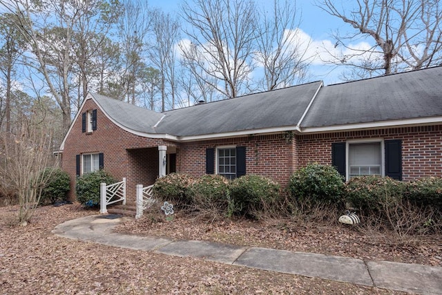 view of side of property with brick siding